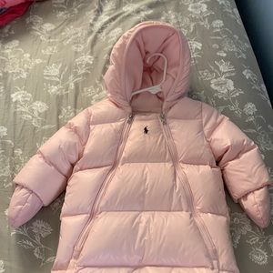 This is a Polo Ralph Lauren baby snowsuit. It is size 6-9 months in light pink.